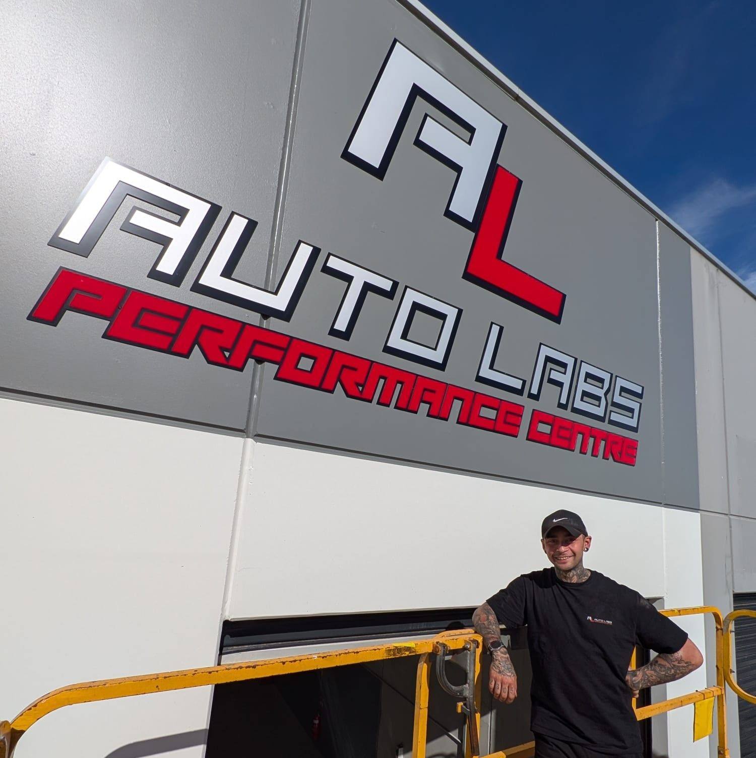 James Garzia standing in front of the Auto Labs Performance Centre signage at Factory 18, 99 Bald Hill Rd, Pakenham