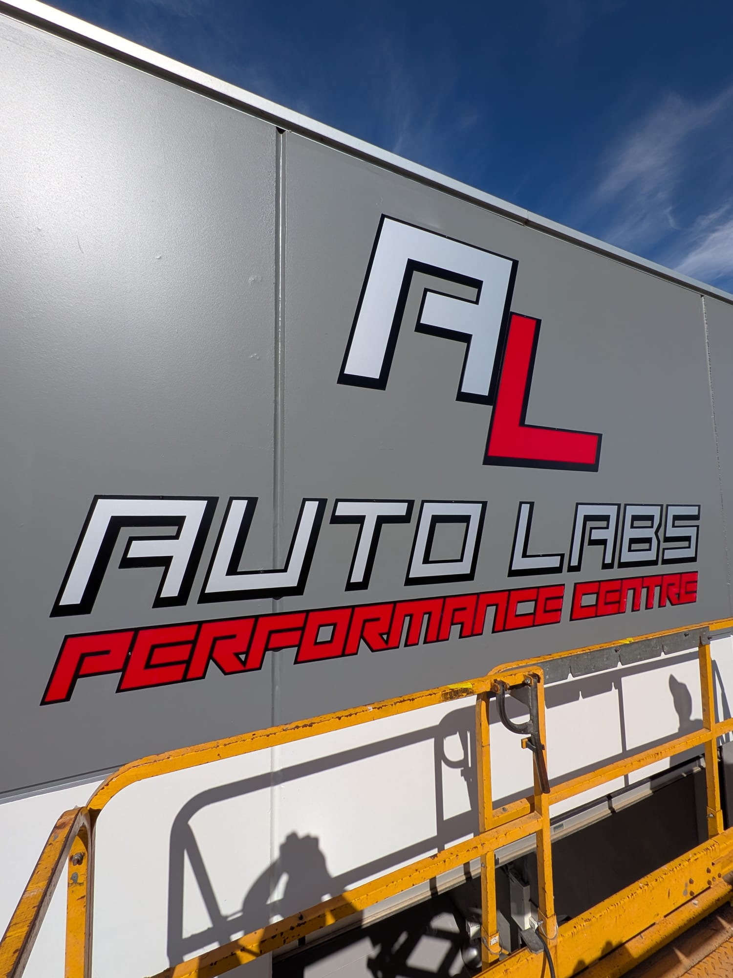 Auto Labs Performance Centre — painted AL monogram and Performance Centre signage on the shopfront at Factory 18/99 Bald Hill Rd, Pakenham VIC